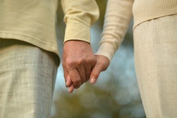 Close up portrait of couple holding hands
