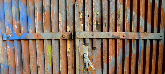 Old wooden door with damaged color