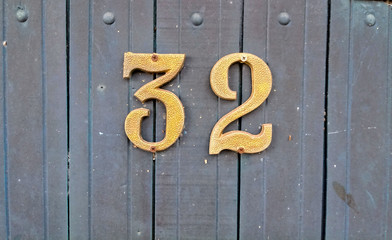 old wooden door with number