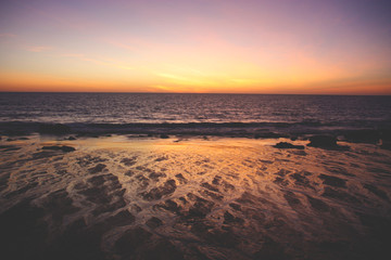 Sunset on beach with water zigzag