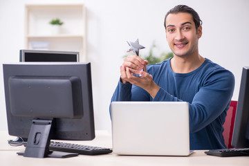 Young male it specialist working in the office