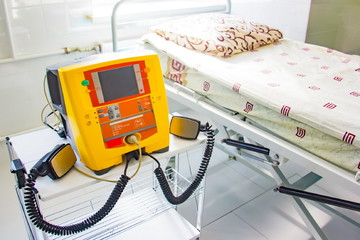 Background of new yellow defibrillator in hospital for health caring