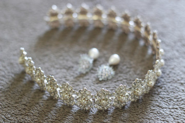 Wedding concept. Bride's hair accessory and earrings