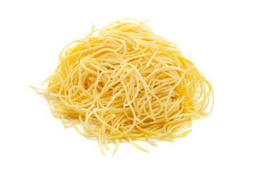 Fresh uncooked capellini pasta isolated on a white background