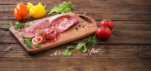 various types of meat and vegetables on  wooden table