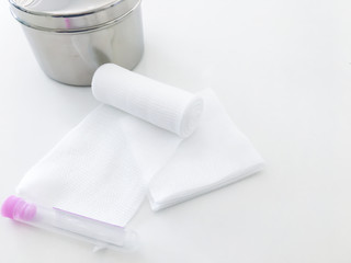 swab ,gauaze ,roll bandage and blood tube with copy space in medical concept
