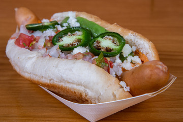 Delicious hot dog with cheddar, jalapeno peppers