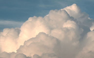 white puffy clouds in the blue sky