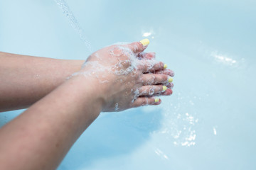 Washing Hands. Coronavirus pandemic prevention wash hands with soap warm water