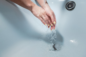 Fototapeta premium Coronavirus pandemic prevention wash hands with soap warm water