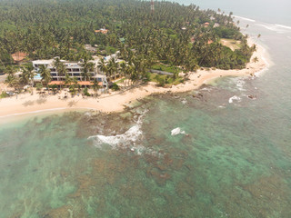Obraz na płótnie Canvas Aerial view to the beach resort and Indian ocean near Hikkaduwa, Sri Lanka