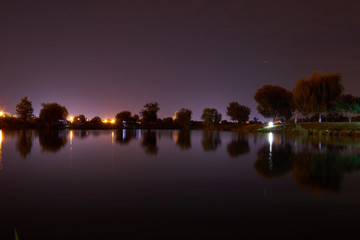 night photography with lake and trees