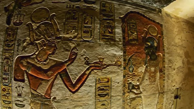 ancient color egypt images and hieroglyphics on wall of tomb
