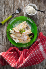 Crepes with ricotta cheese and blackcurrant jam.