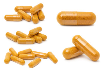  dry Turmeric powder in capsule  isolated on white background.