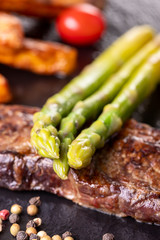 green asparagus on a steak