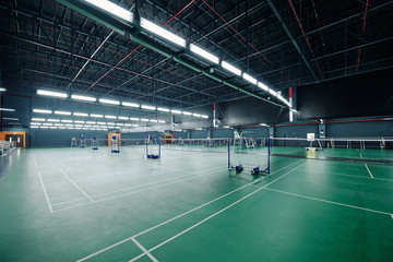 Spacious empty gymnasium for tennis and badminton tournaments