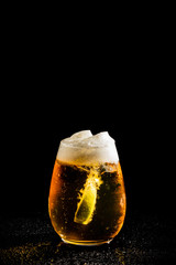 beer with lime on black background