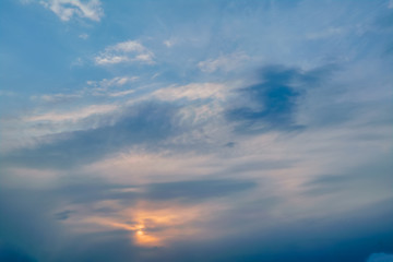 The sky at sunset. Cumulus clouds lit by the rays of the setting sun.