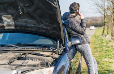 Fototapeta premium driver call the insurance agent in a car accident outside the city