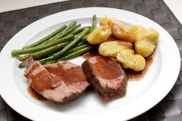 Leg of lamb with homemade gnocchi and green beans