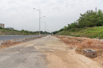 Perspective view of unfinished dirt road subgrade