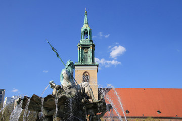 Neptune fountain with the St. Mary's Church in the background, Berlin - Germany