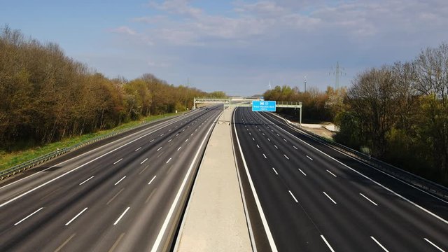 German Autobahn around Munich at Easter sunday 2020 during Corona Virus lockdown measures. Very few cars, birds singing in the background.