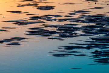 Background pattern of a sandy beach by the sea