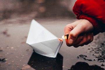 paper boat on fire