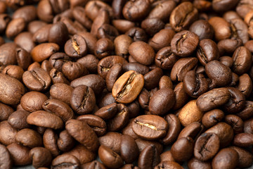 Coffee background. Roasted coffee beans on a dark background. Coffee banner for menu, design and decoration