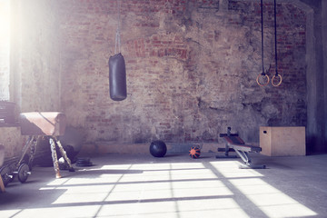 Loft style gym with old brick wall with sports equipment - Powered by Adobe