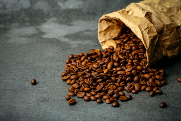 Coffee background. Roasted coffee beans on a dark background. Coffee banner for menu, design and decoration