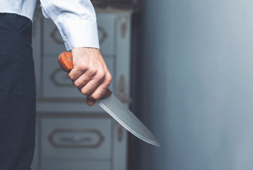 The man with a knife in a hand.