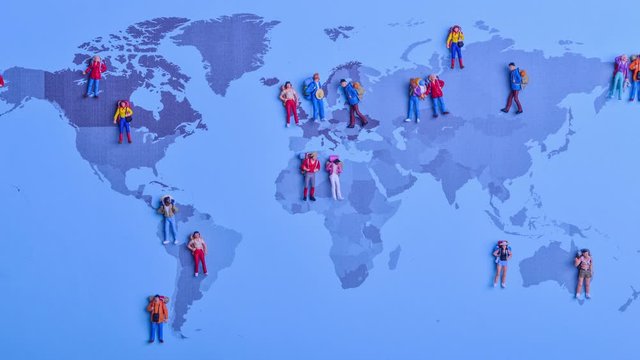 Stop motion of backpacker travellers visit various countries in on world map concept - static shot