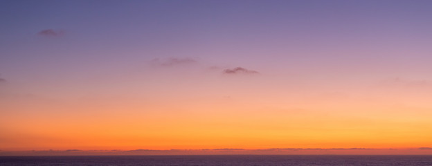 Clear sky at dusk over the ocean