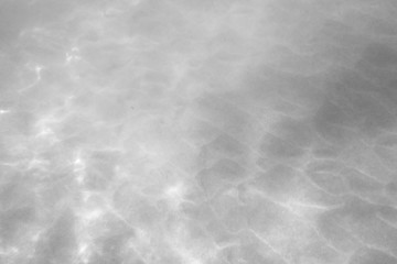 Water in the swimming pool. Grey. Details about water. Texture. Toned