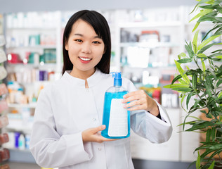 Chinese female pharmacist offers an antibacterial agent in modern pharmacy
