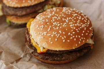 Delicious beef burgers with cheese and ketchup 