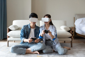 Fototapeta na wymiar A young asian couple are playing games together