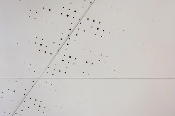 Background Wall of metal sheets with a geometric pattern.