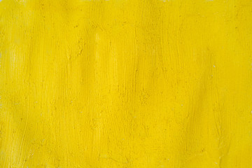A beautiful Yellow paint texture on wall, background - Image. Color paint strokes.
