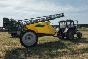 tractor sprayer to protect plants from pests in the field