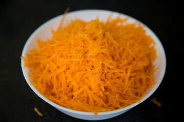 Grated carrot for lunch. Organic vegetable.