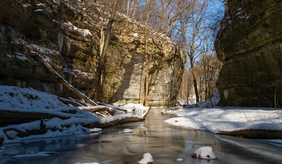 Fototapeta na wymiar Frozen trails on a cold winter morning. Starved rock state park, Illinois, USA.
