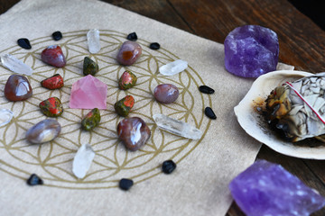 A close up image of a crystal energy healing grid using the flower of life pattern. 