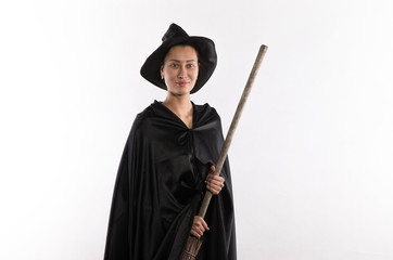 beautiful halloween witch with a broom on a white background