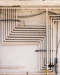 Complex piping on the exterior of an apartment building, Basque Country, Spain