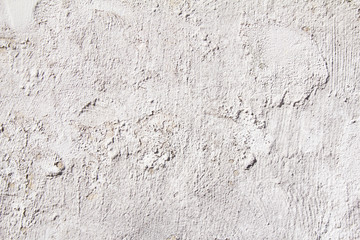Grey plaster painted wall with rough grungy surface texture background.