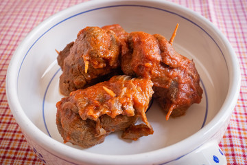 Delicious dish made of beef meat roll called braciola with tomato sauce. Apulia typical food. Italy